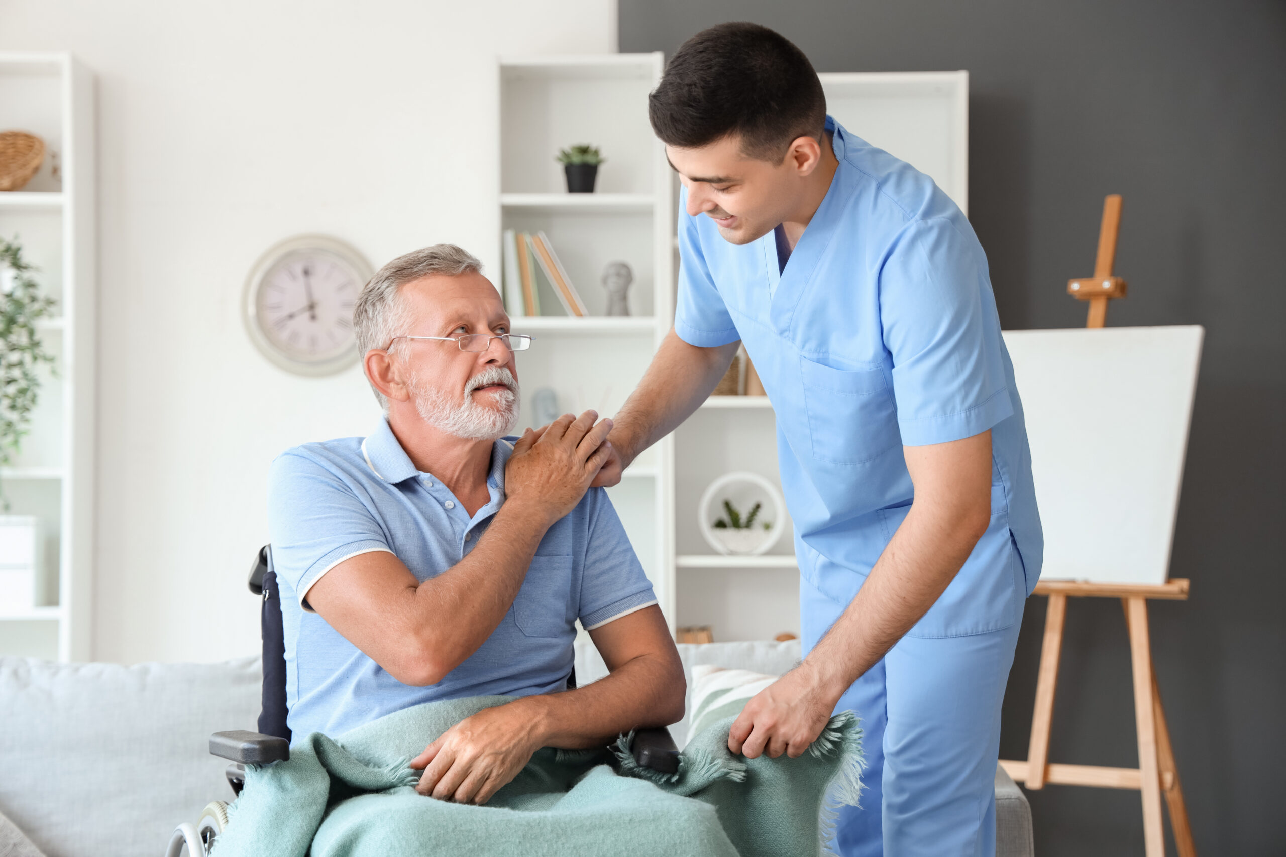 Hospice Aide comforting patient.